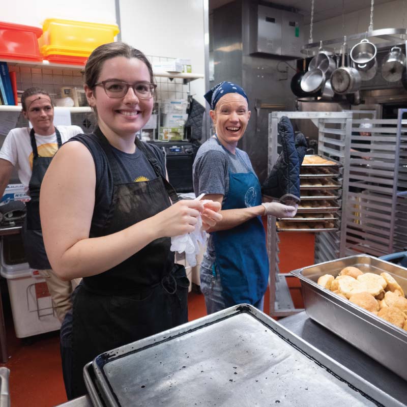 Two people working in the kitchen